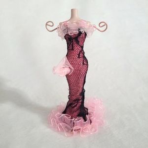 Jewelry stand/holder porcelain manican with detailed dress. Two prongs.